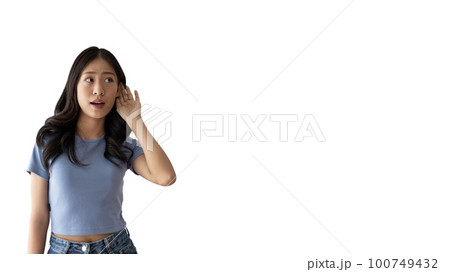 Asian woman eavesdropping or overhearing secret conversation isolated on white background, Gossip, Listening, white background studio portrait. 100749432
