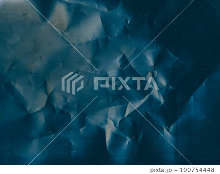 Crinkled texture. Aged film overlay. Distressed foil. Blue color flare dust scratches noise on dark wrinkled weathered abstract illustration background. 100754448