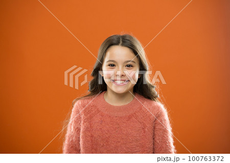 What is difference between phony and sincere smile. What science has to say about genuine and fake smiles. Child long hair happy smiling. Happy childhood concept. Girl cute child happy smiling face 100763372