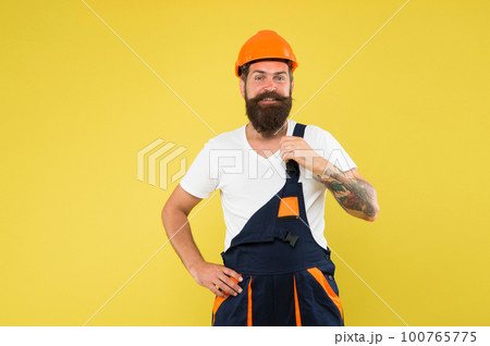 Major renovation places strong emphasis natural materials and sustainability. Improvement and renovation. Brutal man builder. Engineer builder uniform. Man builder hard hat. Creativity and practice 100765775