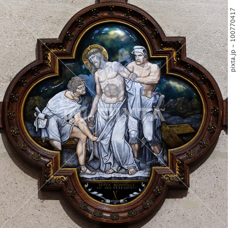 10th Stations of the Cross, Jesus is stripped of His garments, St Francis Xavier's Church in Paris, France 100770417