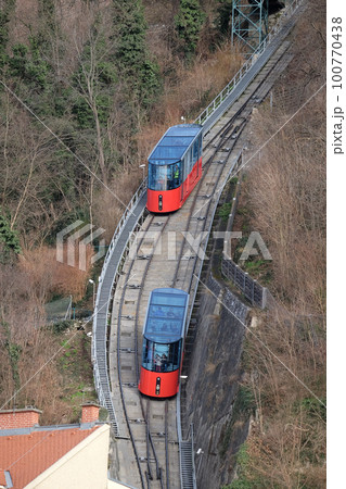 Modern funicular climbing to Schlossberg in Graz, Austria 100770438