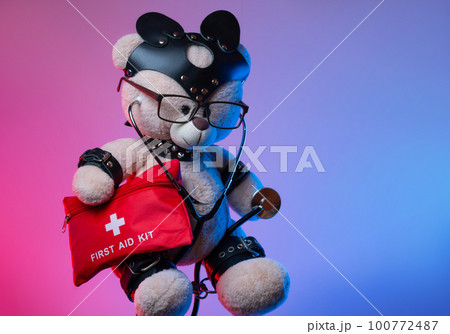 toy teddy bear with leather straps and a mask for BDSM games with a first aid kit , safety and precautions in bdsm sex games toy teddy bear with leather straps and a mask for BDSM games with a first aid kit , safety and precautions in bdsm sex games 100772487