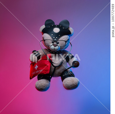 toy teddy bear with leather straps and a mask for BDSM games with a first aid kit , safety and precautions in bdsm sex games toy teddy bear with leather straps and a mask for BDSM games with a first aid kit , safety and precautions in bdsm sex games 100772489