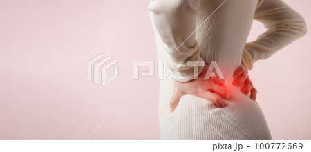 Young woman have waist pain, back ache, lumbar muscle injury problem. Office syndrome disease sick. Healthcare world health day concept. Young woman have waist pain, back ache, lumbar muscle injury problem. Office syndrome disease sick. Healthcare world health day concept. 100772669