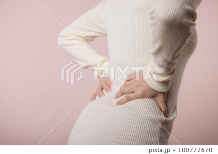 Young woman have waist pain, back ache, lumbar muscle injury problem. Office syndrome disease sick. Healthcare world health day concept. 100772670