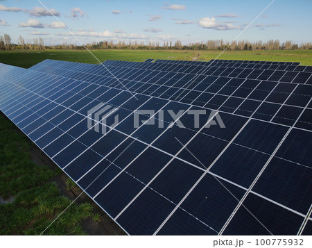 Aerial view of solar power plant solar panels. Electric panels for producing clean ecologic energy. 100775932