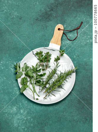Fresh herbs on white, green background. Top view 100778665