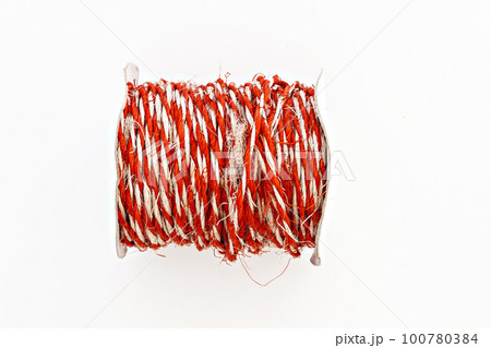 kraft red twine in a roll isolated kraft red twine in a roll isolated 100780384