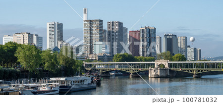 River Seine In Paris With Promenade, Anchored Ships, Hot Air Balloon And Modern Office Buildings River Seine In Paris With Promenade, Anchored Ships, Hot Air Balloon And Modern Office Buildings 100781032