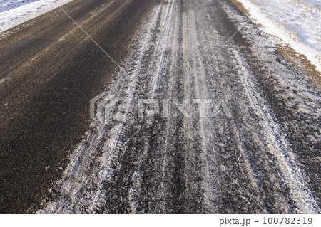A road covered with snow and ice for cars A road covered with snow and ice for cars 100782319