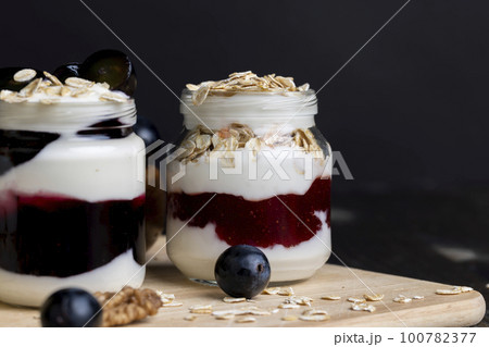 sweet yogurt with grape flavor, close up 100782377