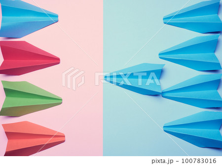 Two groups of paper boats facing each other, a concept of confrontation 100783016