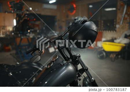 Motorbike parked in biker garage or service motor shop 100783187