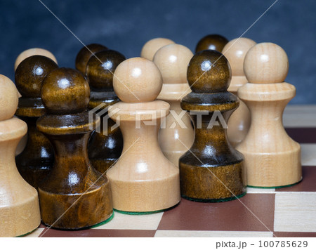 Chess board with figures. Wooden chess. Board games. Location of opponents. Counter strategy. Pawns 100785629