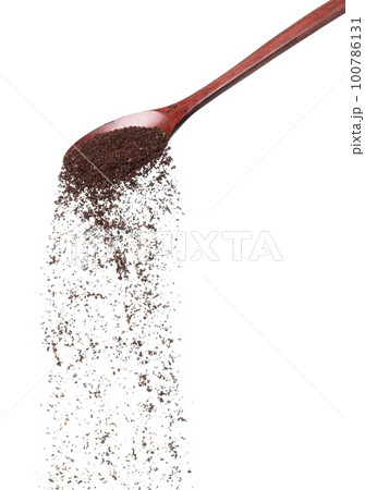 Coffee powder fall down pour in wooden spoon, Coffee crushed float explode, abstract cloud fly. Coffee dust powder splash throwing in Air. White background Isolated high speed shutter, freeze motion 100786131