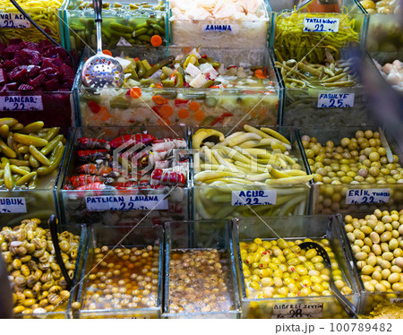 Natural marinades and pickles on Turkish market counter 100789482