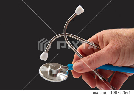 stethoscope on a dark background. heart rate medical instrument 100792661