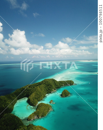 Pristine blue ocean, rock islands in Palau 100798511