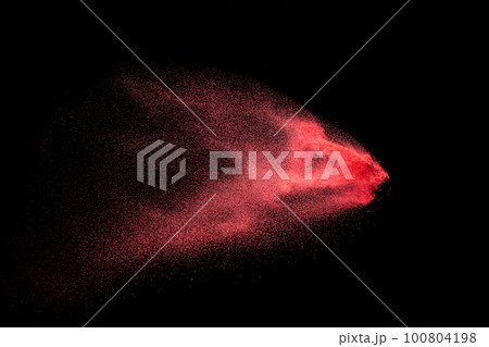 Red dust particles explosioon on black background.Red powder splash. Red dust particles explosioon on black background.Red powder splash. 100804198