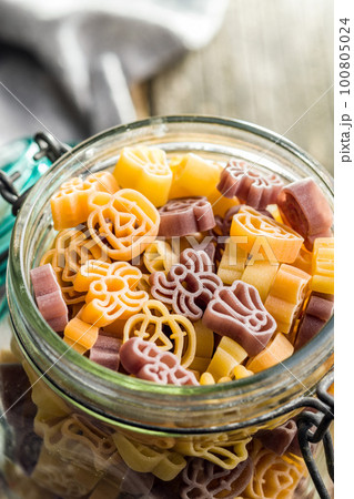 Pasta of various scary shapes. Uncooked halloween pasta in jar. 100805024