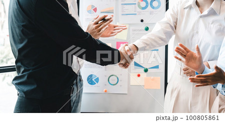 Business partnership meeting concept. Image businesspeople handshake. Successful businesspeople handshaking after good deal. Group support concept 100805861