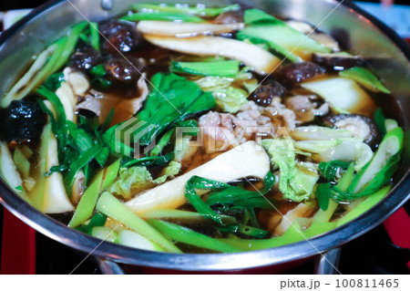 vegetable and pork soup , shabu or sukiyaki 100811465