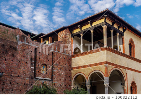 Milan, Italy Ducal Courtyard low angle day view of Sforzesco Castle - Castello Sforzesco - Medieval apartments residence, the loggia of Galeazzo Maria Sforza against puffy clouds sky. 100822112