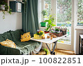 Table with spring flowers prepared for planting indoors 100822851