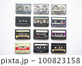 Collection of old audio cassette tapes isolated on white background, vintage music 100823158