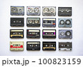 Collection of old audio cassette tapes isolated on white background, vintage music 100823159