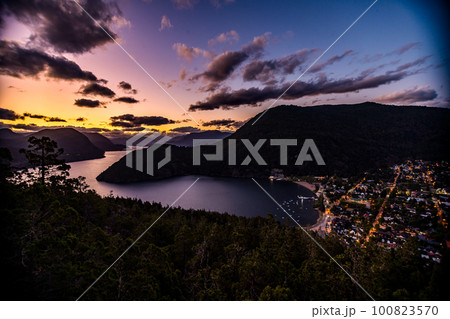 Beautiful landscape with tones in mountain lake, blue sky and yellow in sunrise 100823570