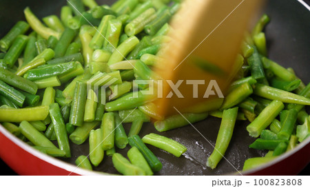 Preparation of frozen green beans. Cooking concept, cookbook, recipes Preparation of frozen green beans. Cooking concept, cookbook, recipes 100823808