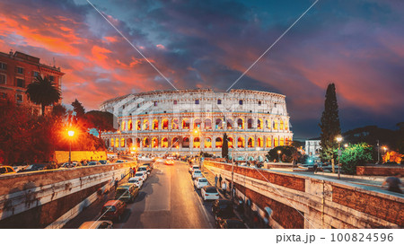 Rome, Italy. Colosseum Also Known As Flavian Amphitheatre In Evening Or Night Time. Amazing Sunset Sky With Saturated Colorful Clouds. Travel Italy 100824596