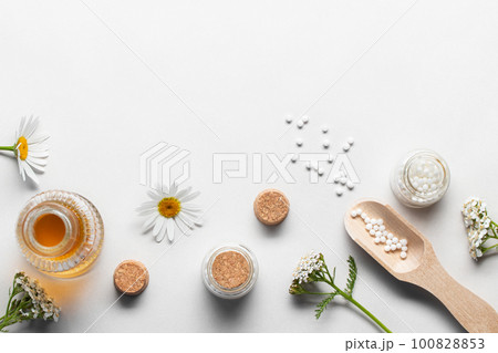 Homeopathic medicines and medicinal plants on a light background, copy space Homeopathic medicines and medicinal plants on a light background, copy space 100828853