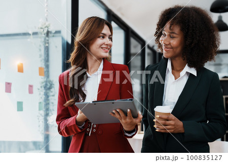 Multiethnic business, Beautiful American African with asian businesswomans people in meeting. Accountant people do document, tax, exchange, accounting and Financial advisor. 100835127