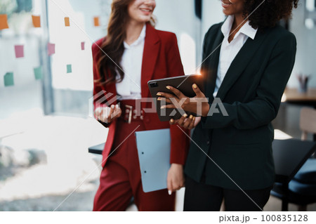 Multiethnic business, Beautiful American African with asian businesswomans people in meeting. Accountant people do document, tax, exchange, accounting and Financial advisor. 100835128