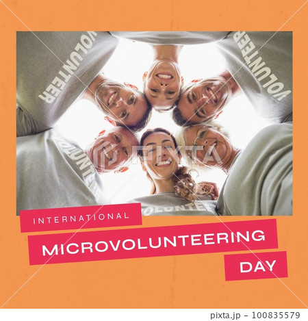 Low angle view of smiling diverse volunteers huddling and international microvolunteering day text 100835579