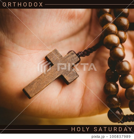 Composition of orthodox holy saturday text and rosary with cross 100837989
