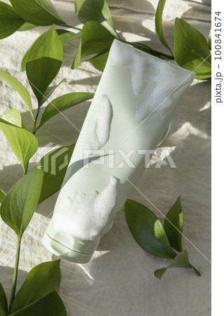 creative photo of nature and beauty products, foam cleansing and leaves creative photo of nature and beauty products, foam cleansing and leaves 100841674