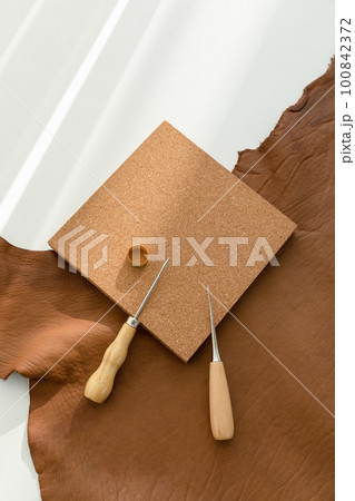 aesthetic photo of handmade, crafting hobbies, leather and awl 100842372