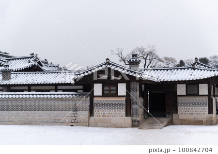 snowing winter scenery of Changdeokgung palace, Korea snowing winter scenery of Changdeokgung palace, Korea 100842704