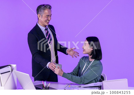 relationship and conflict between younger and older workers concept, Korean Asian young woman and manager level older man 100843255