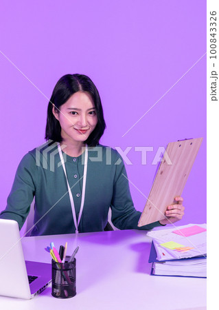 business working concept, young Korean Asian woman concentrating on her work business working concept, young Korean Asian woman concentrating on her work 100843326