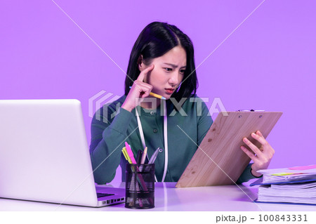 business working concept, young Korean Asian woman concentrating on her work 100843331