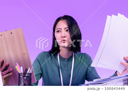 business working concept, young Korean Asian woman concentrating on her work business working concept, young Korean Asian woman concentrating on her work 100843449