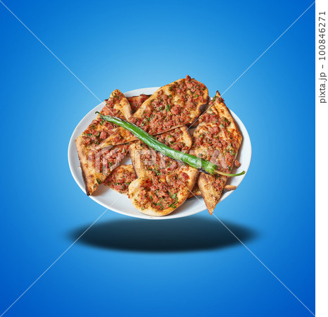 Floating Turkish Pide on Plate on blue gradient Floating Turkish Pide on Plate on blue gradient 100846271