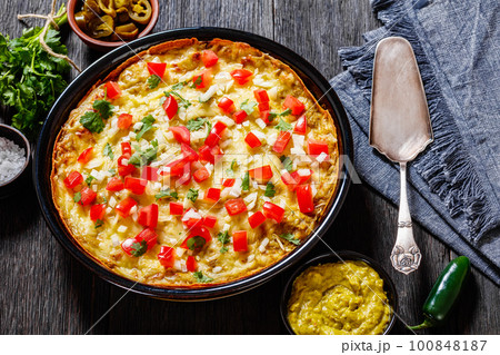 Green Chile Enchilada Casserole in baking dish 100848187
