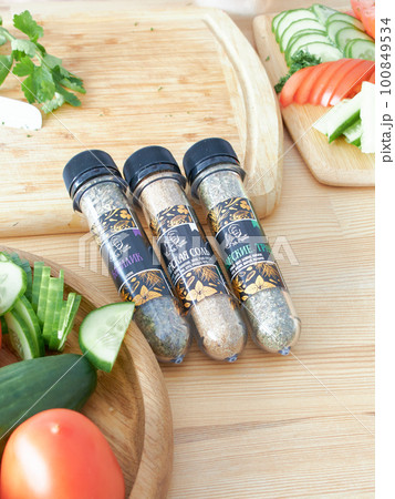 A set of glass jars with different spices in a wooden box in the kitchen. Kazan, 17 March 2023 A set of glass jars with different spices in a wooden box in the kitchen. Kazan, 17 March 2023 100849534