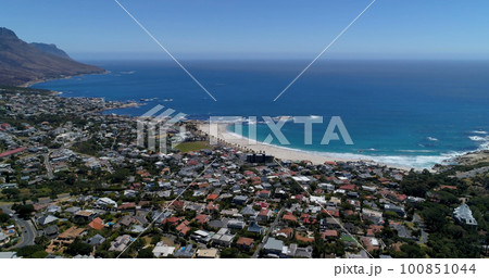 General view of cityscape with houses, mountains, sea and blue sky General view of cityscape with houses, mountains, sea and blue sky 100851044